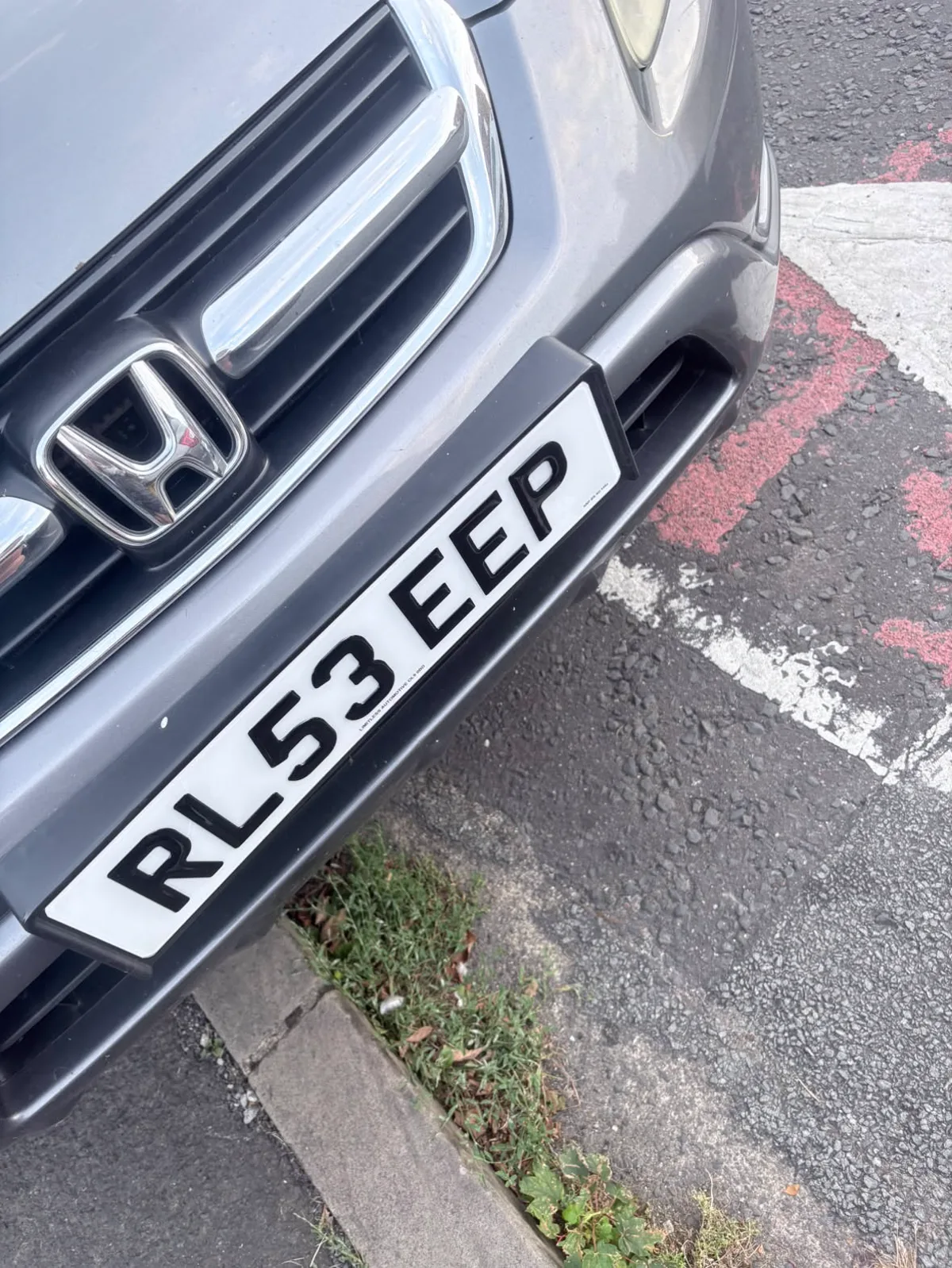 Honda with a white 3D gel front number plate by LLA Plates